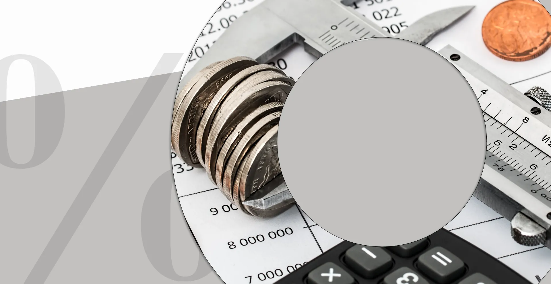A stack of coins on a calculator and measuring tape beside a large percentage sign